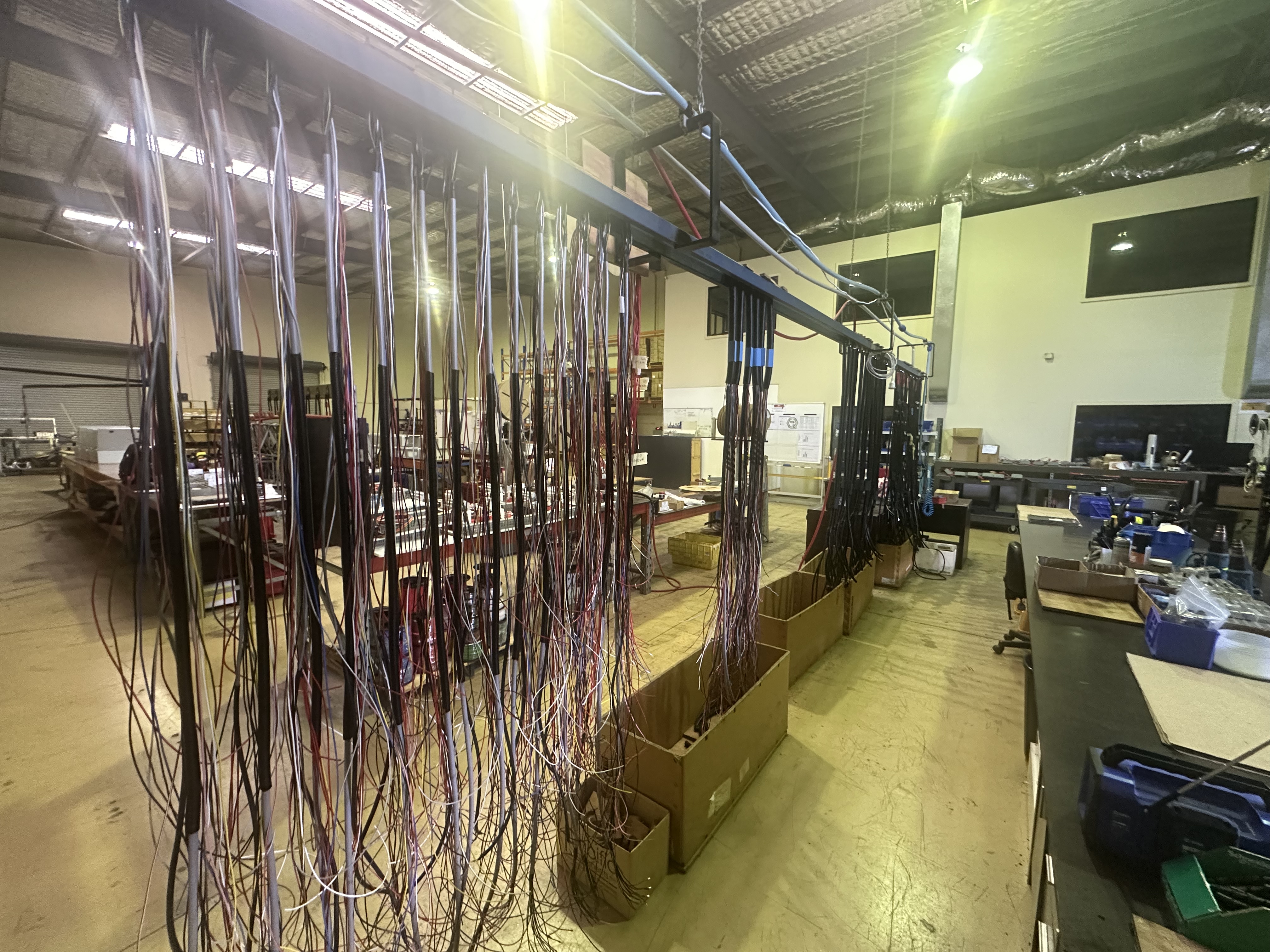 Industrial wiring harness production — multi-conductor looms on jig