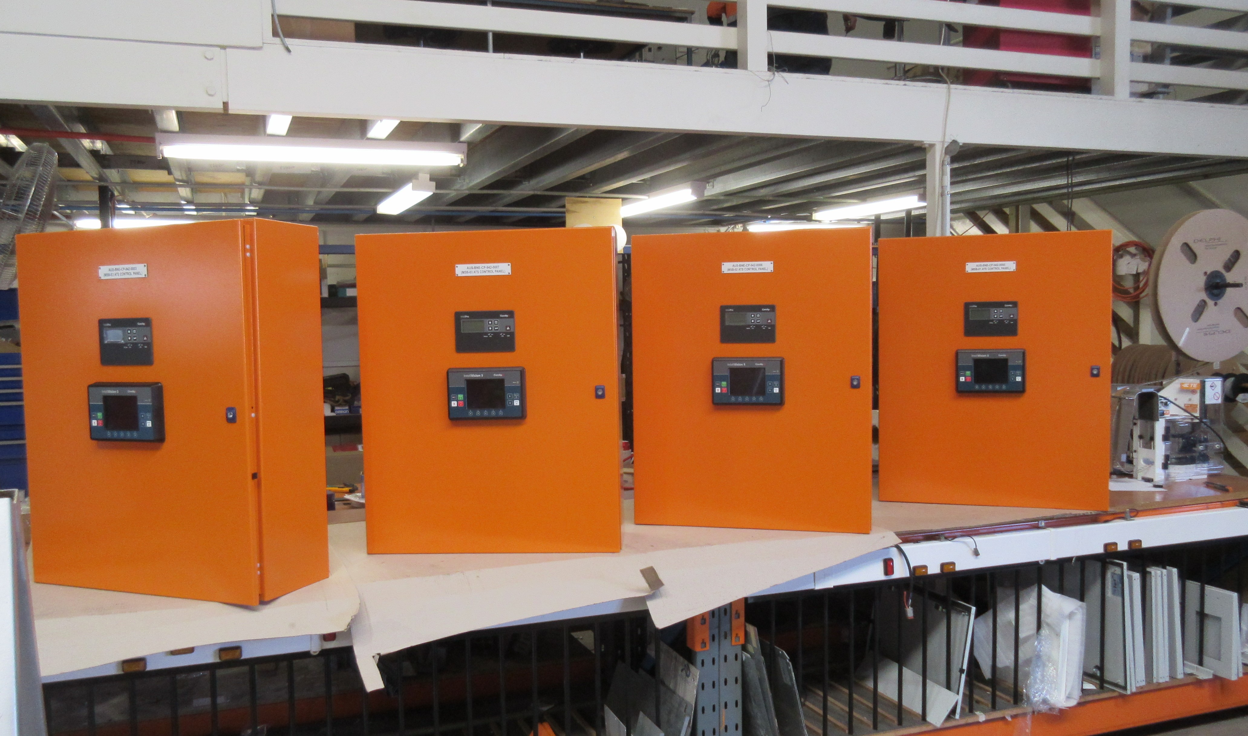 Four identical OEM control panels lined up after a batch production run at Heavy Duty Controls, Yatala QLD
